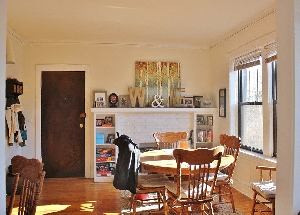 a dining room with a table and chairs
