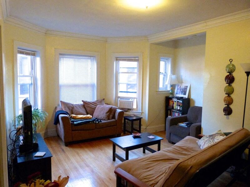 a living room with a couch and a chair