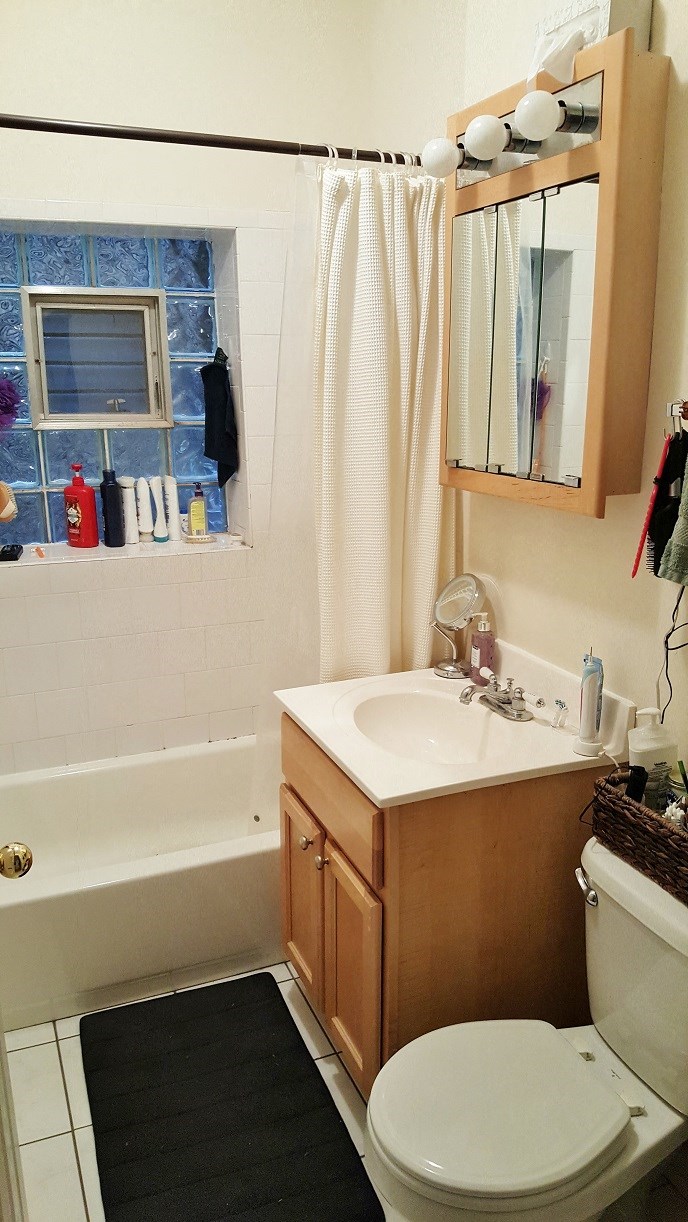 a bathroom with a sink toilet and bath tub