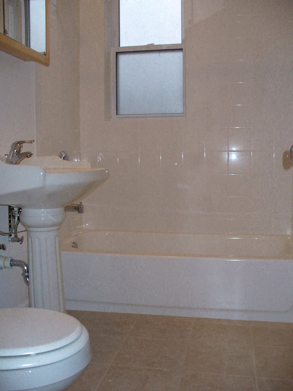 a bathroom with a sink and a toilet and a tub