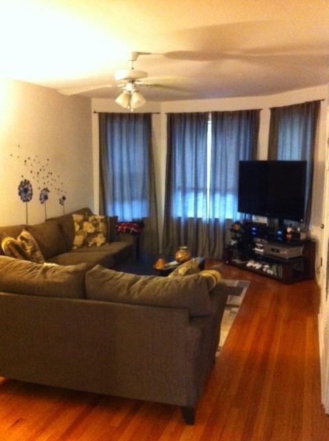 a living room with a couch and a television