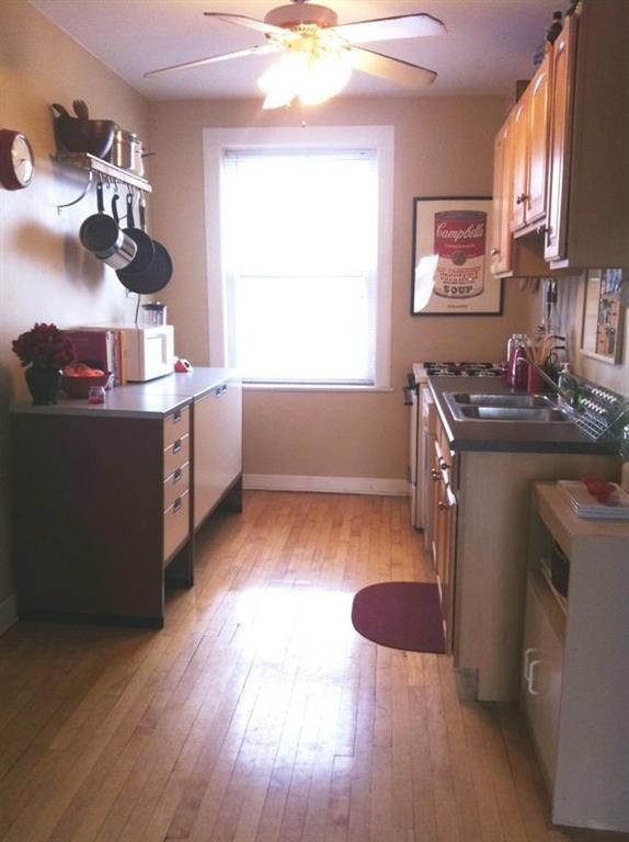 a kitchen with a sink and a window
