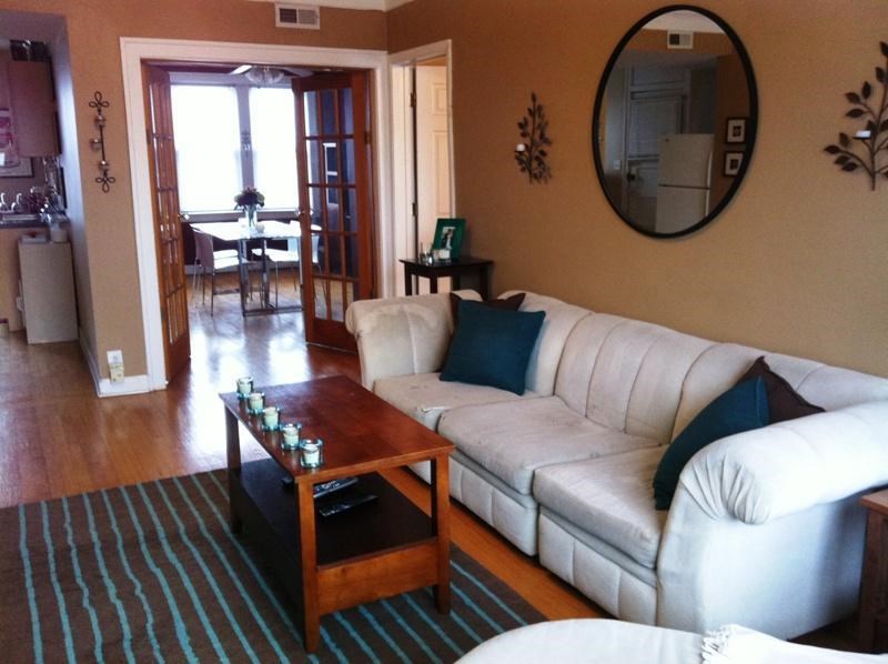 a living room with a white couch and a coffee table