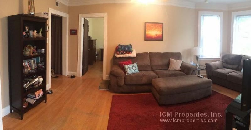 a living room with a couch and a chair