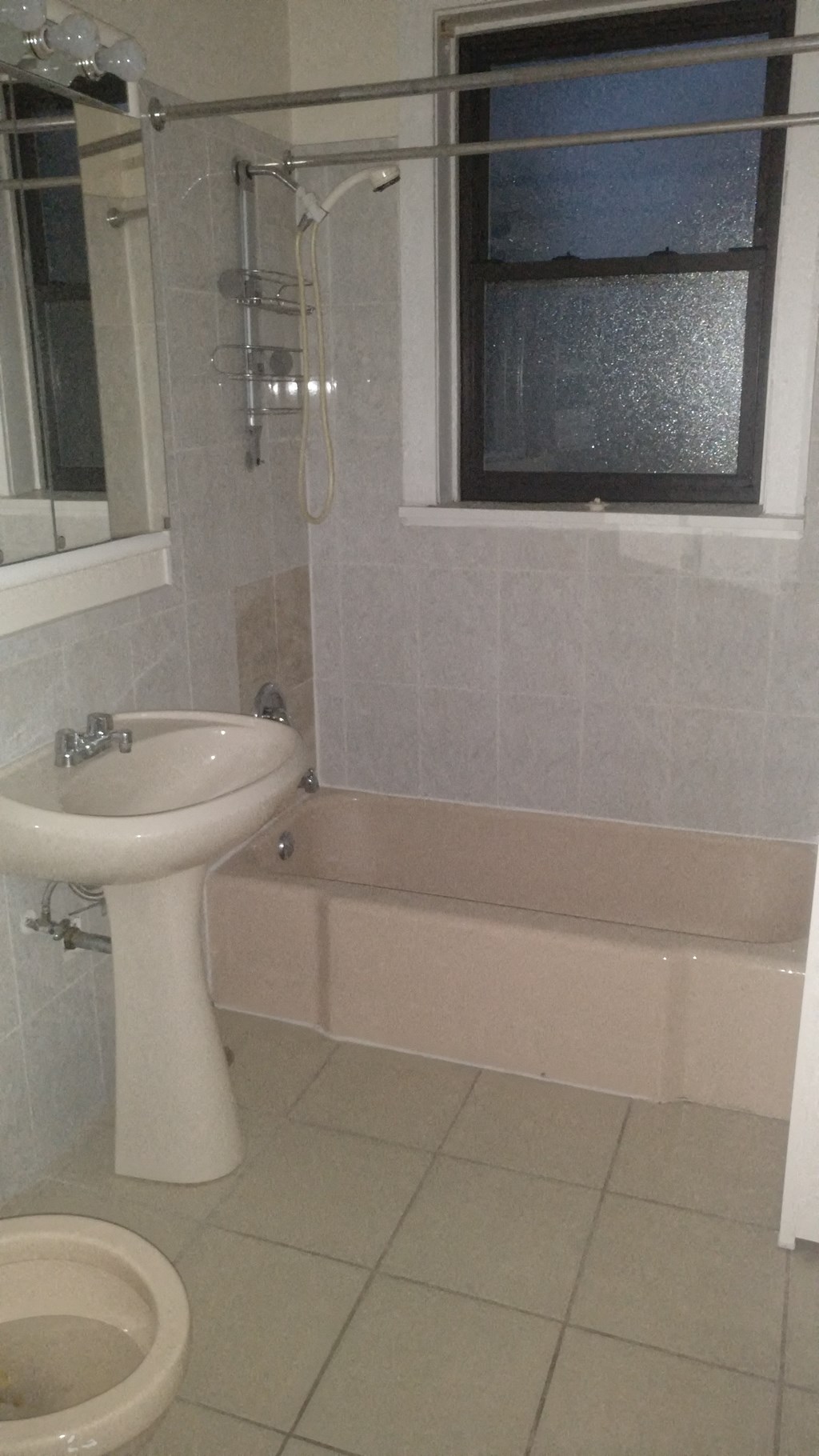 a bathroom with a sink and a bath tub