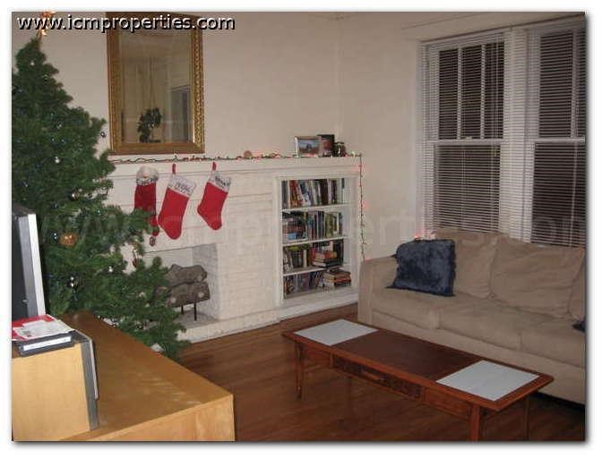 a living room with a christmas tree and a couch