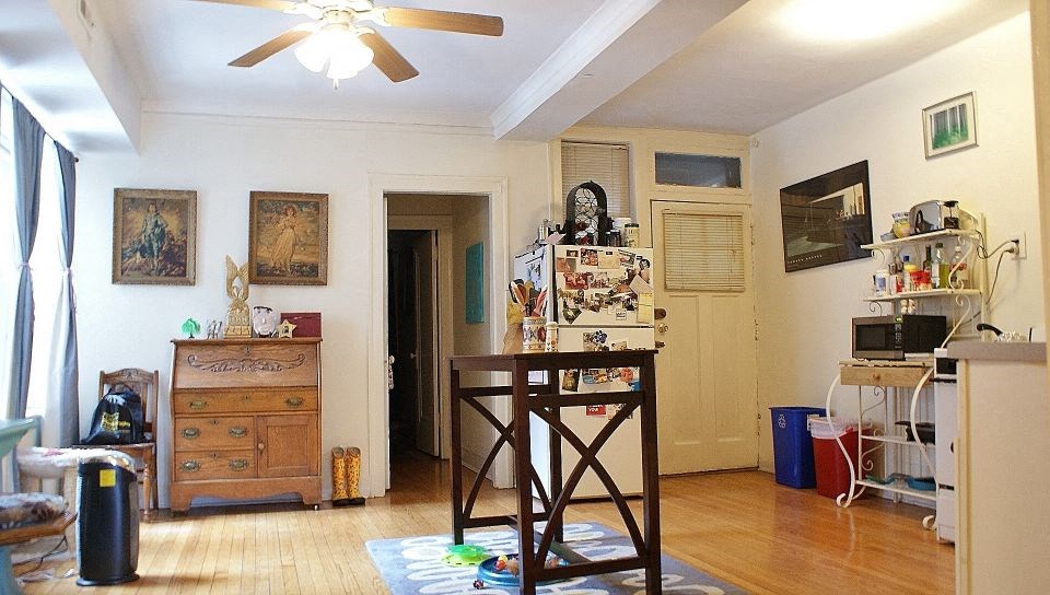 a living room with a table in the middle of it