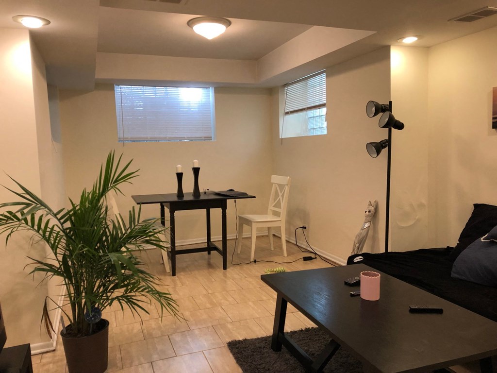 a living room with a table and a couch