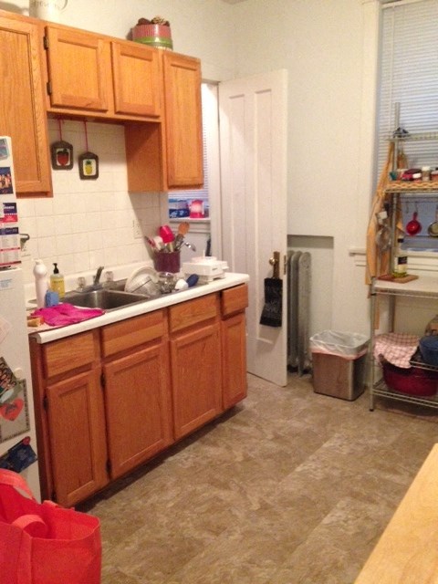 a kitchen with a sink and a refrigerator