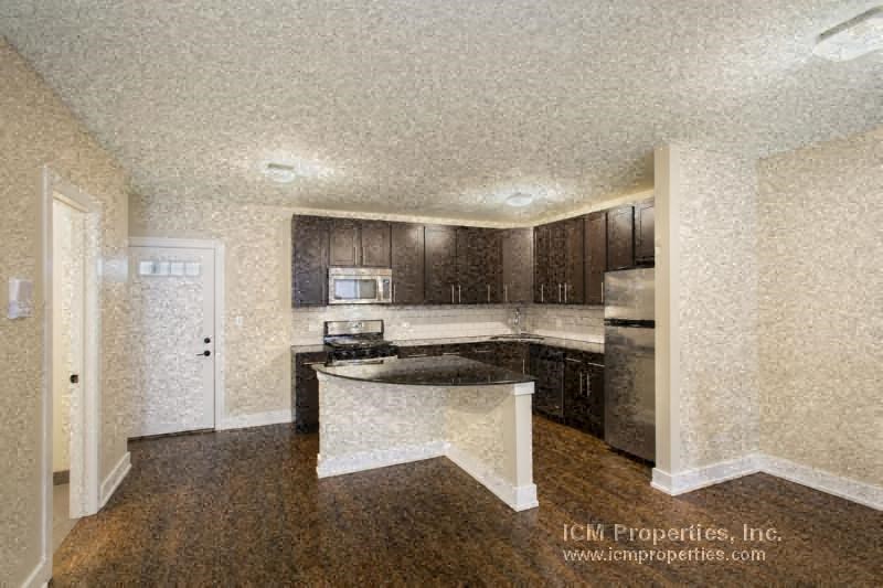 a kitchen with a counter top and