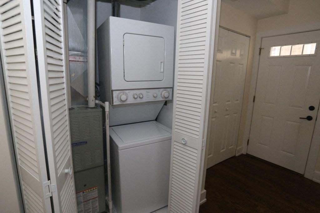 a small laundry room with a washer and dryer
