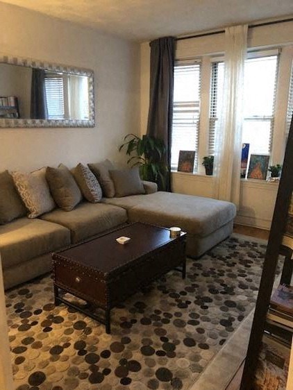 a living room with a couch and a coffee table