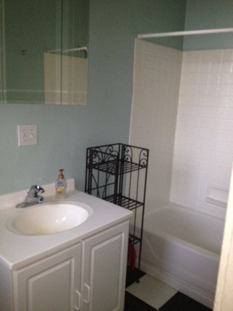 a bathroom with a sink and a bath tub