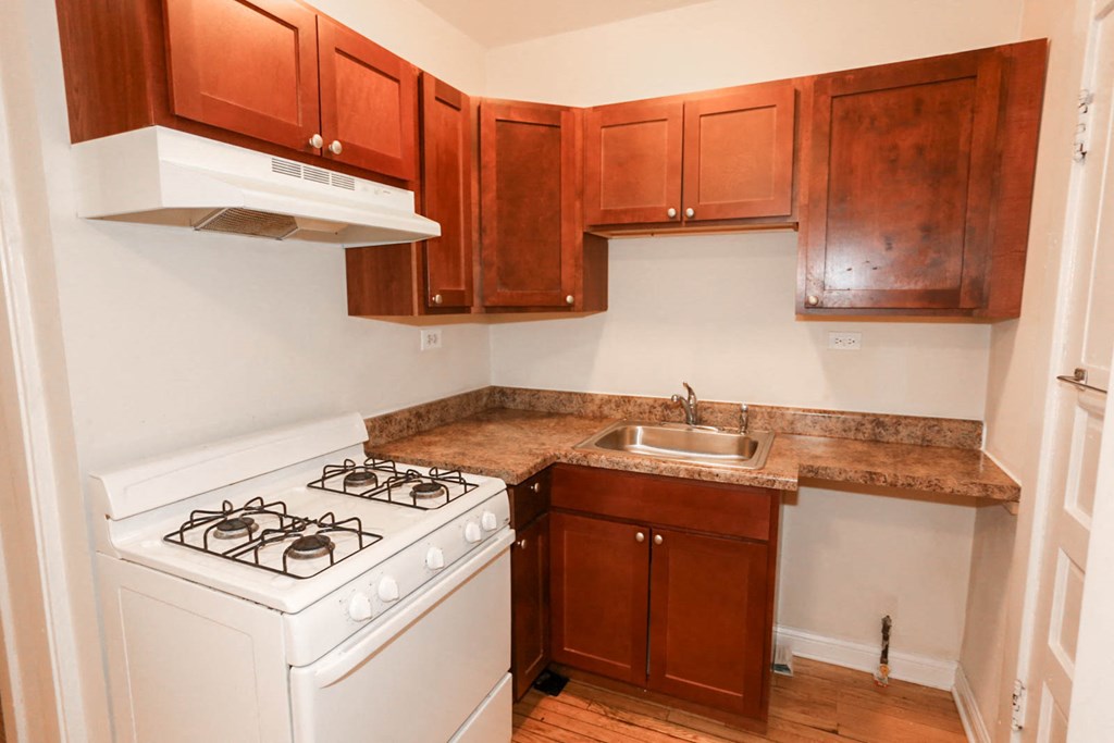 a kitchen with a stove and a sink