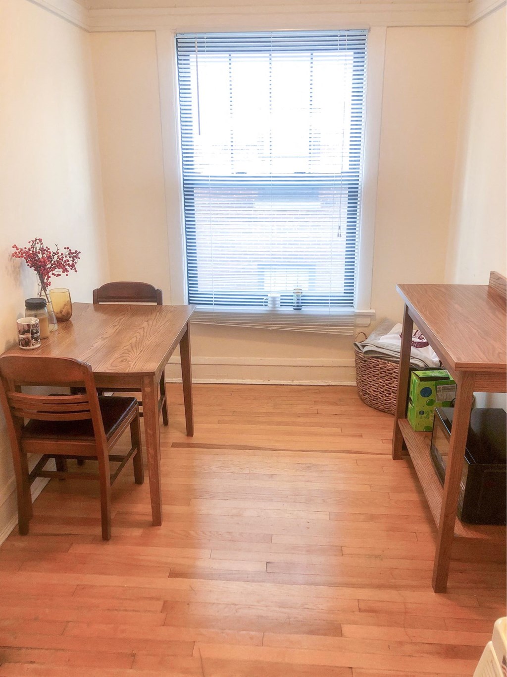 a dining room with a table and a window