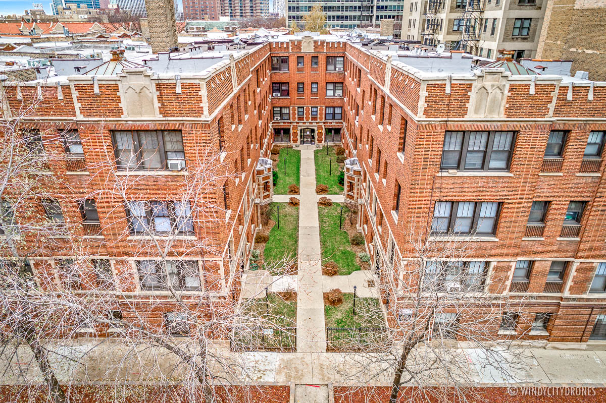 an aerial view of some old brick buildings in the city