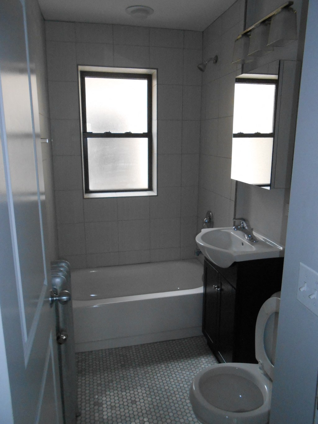 a bathroom with a sink toilet and a bath tub