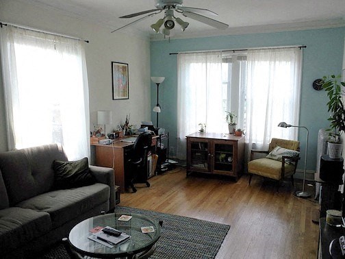 a living room with a couch and a table