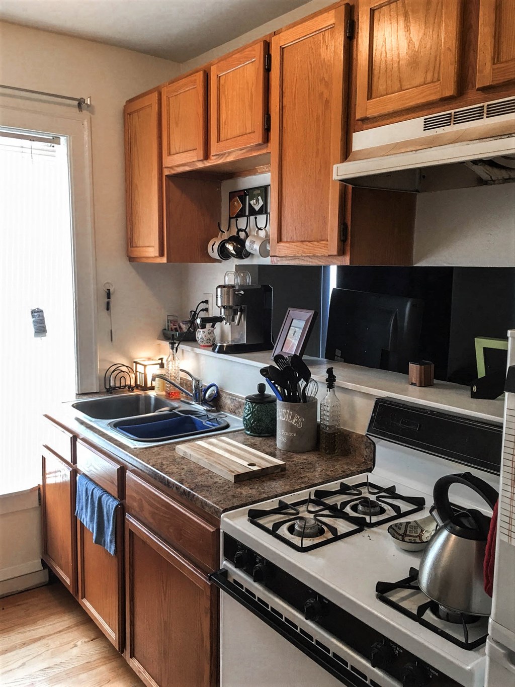 a kitchen with a stove and a sink