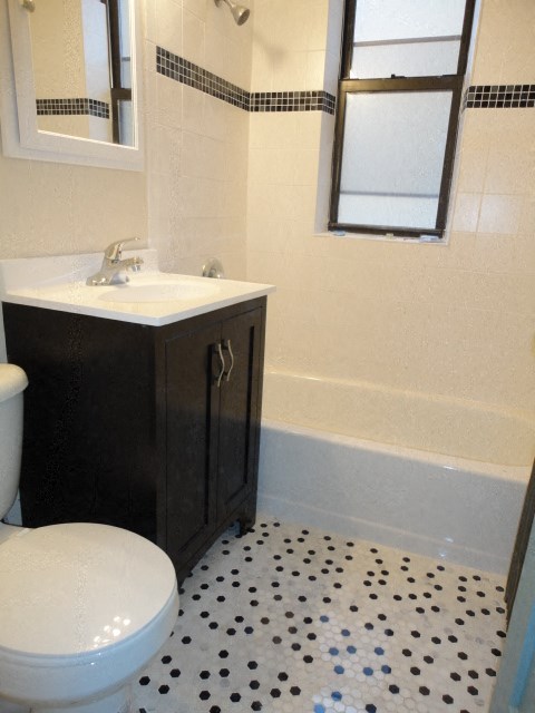 a bathroom with a white toilet and a sink