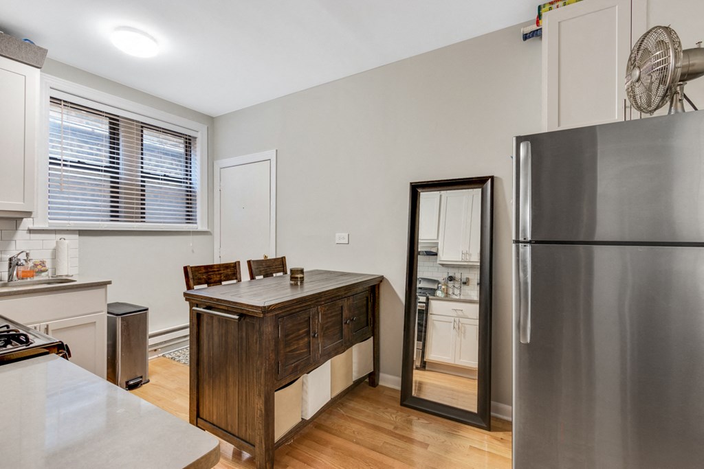 a kitchen with a counter top and a refrigerator
