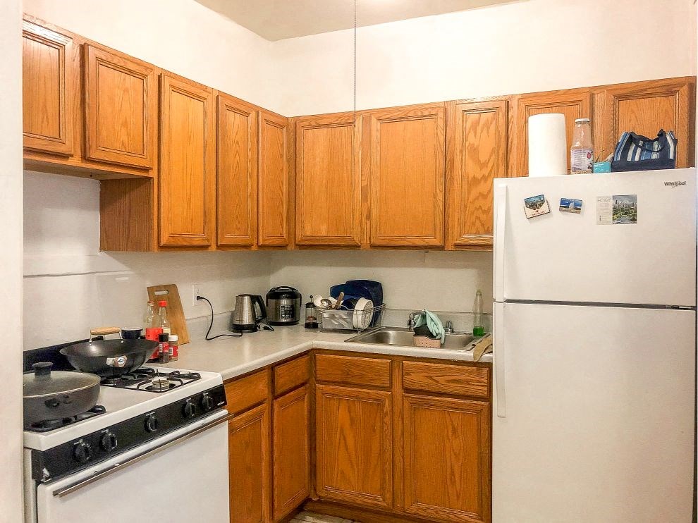 a kitchen with a stove and a refrigerator