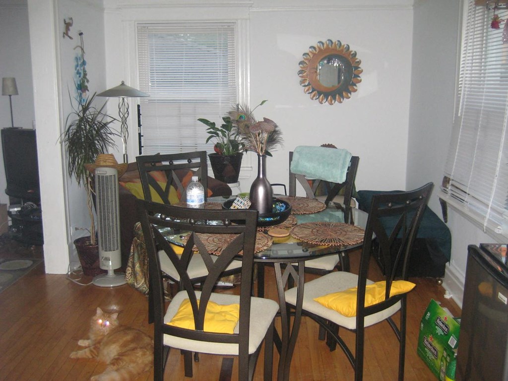a dining room with a table and chairs