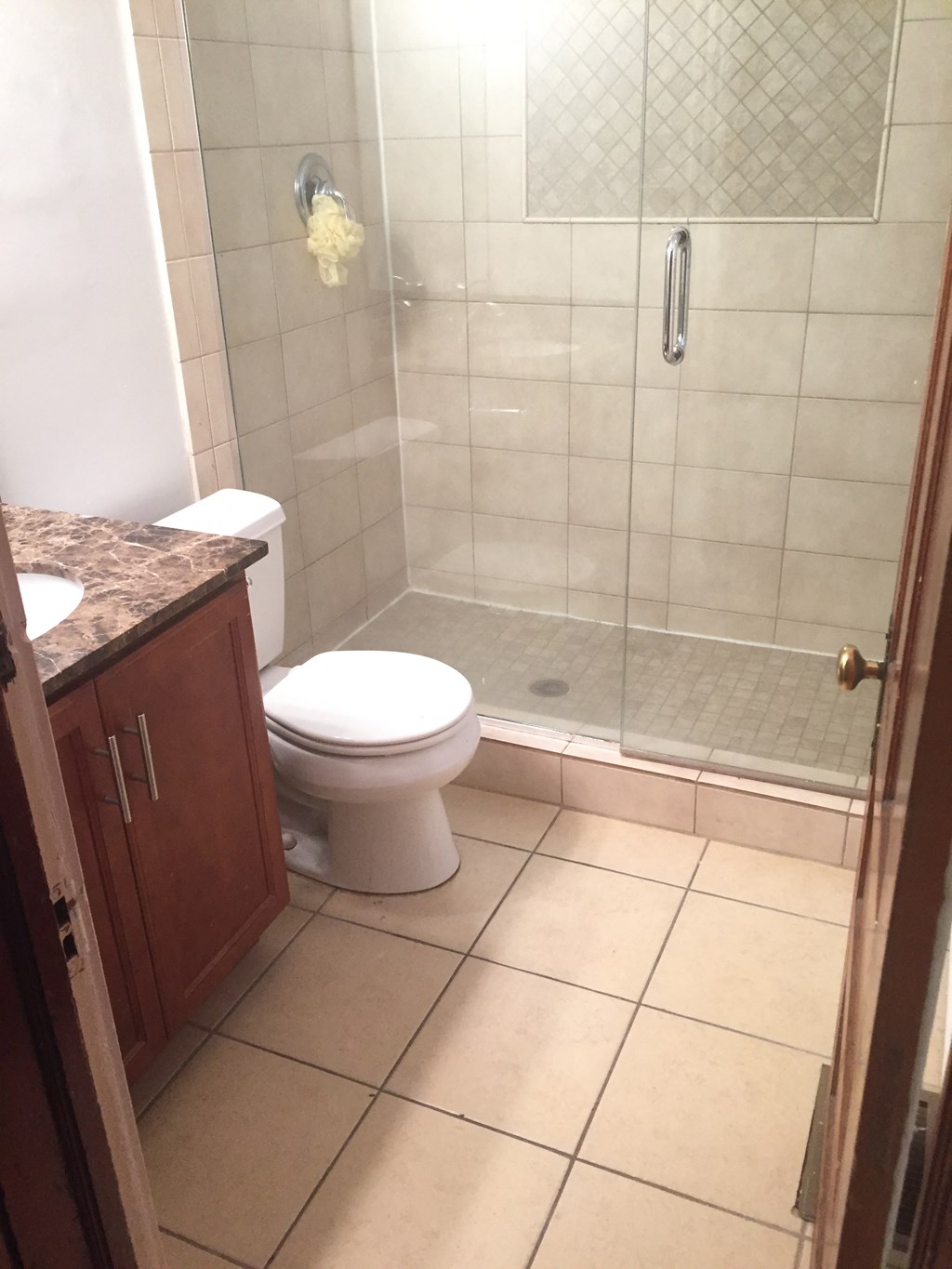 a small bathroom with a toilet and a shower