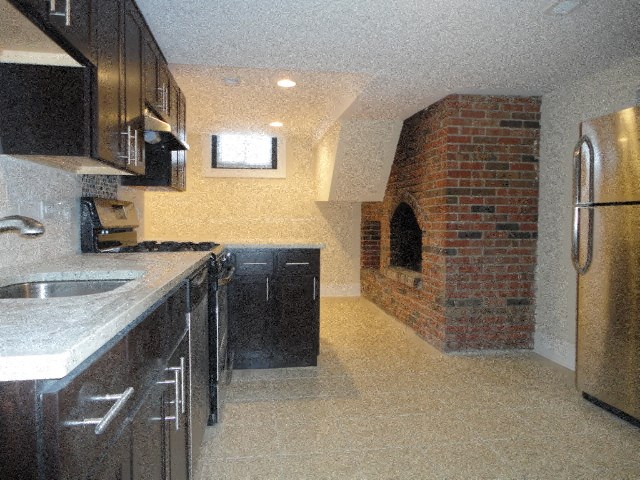 a kitchen with a sink and a refrigerator