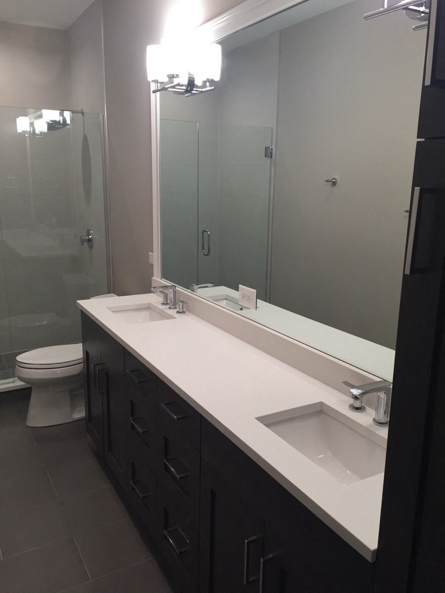 a bathroom with a sink and a toilet and a mirror