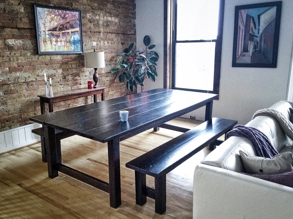 a dining table and a couch in a living room