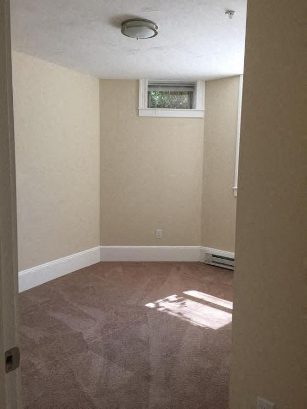 an empty room with a window in it