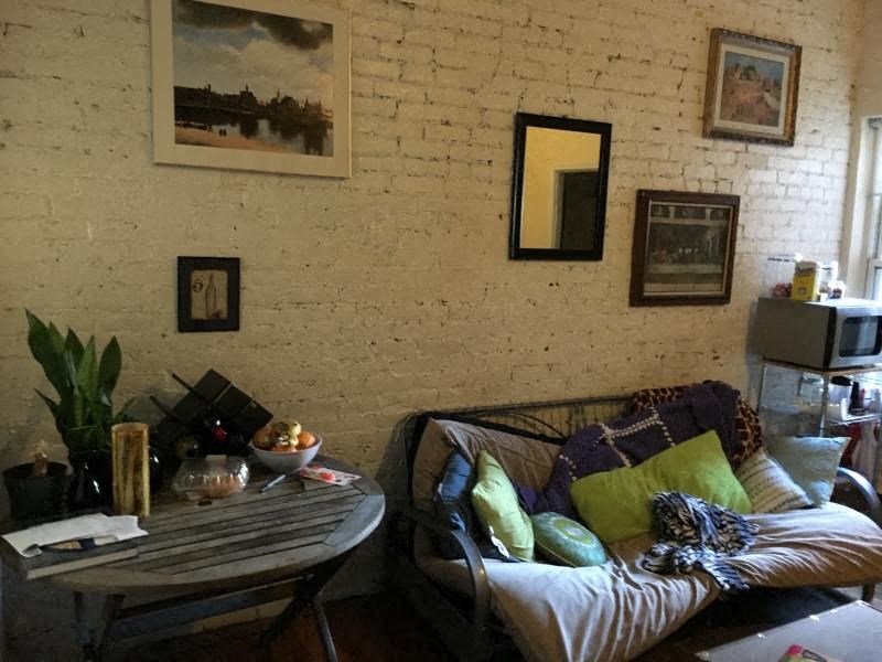 a living room with a couch and a table
