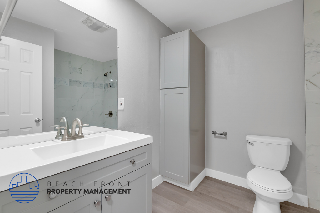 a bathroom with a sink and a toilet and a mirror