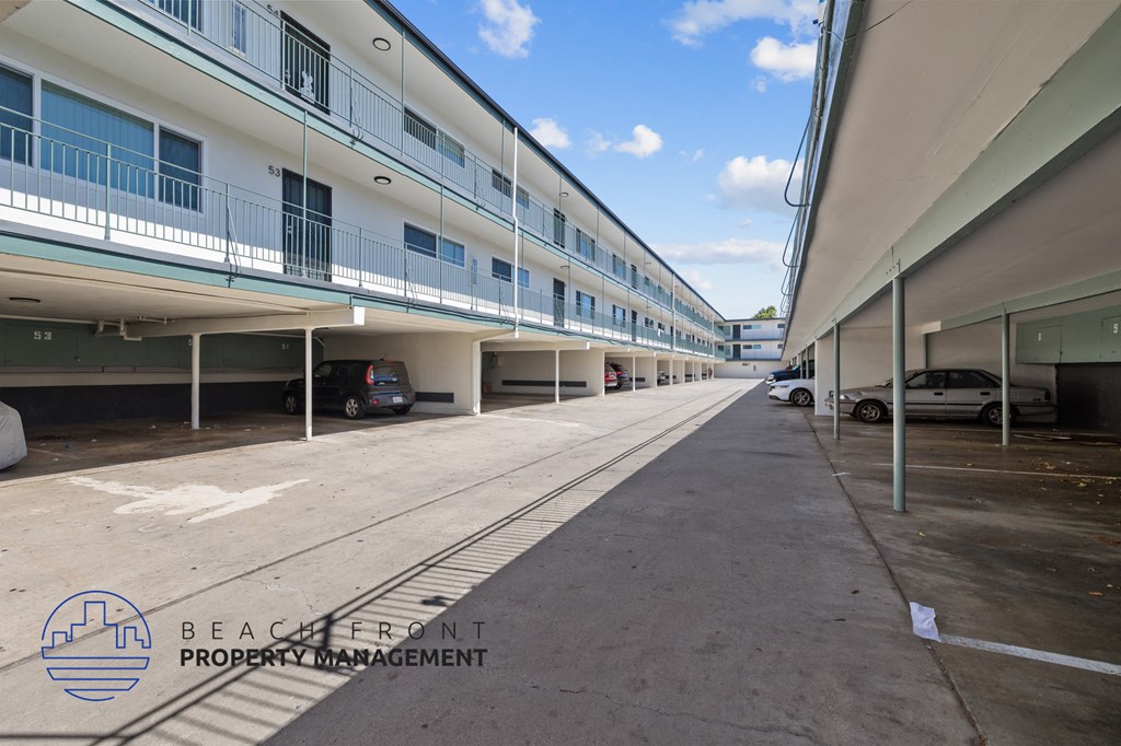 A parking garage with a car parked on the second floor.