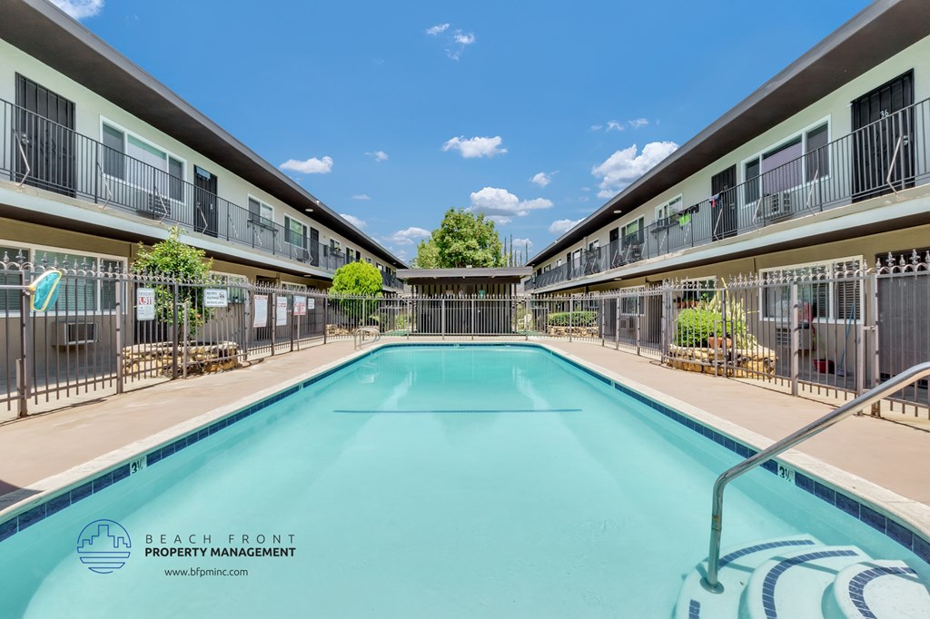 a view of the pool at beachfront promenade apartments or nearby