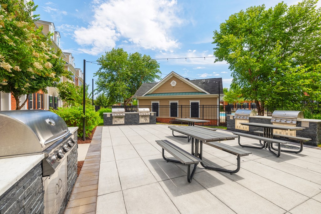 the preserve at ballantyne commons commons patio with picnic tables and barbecue grill