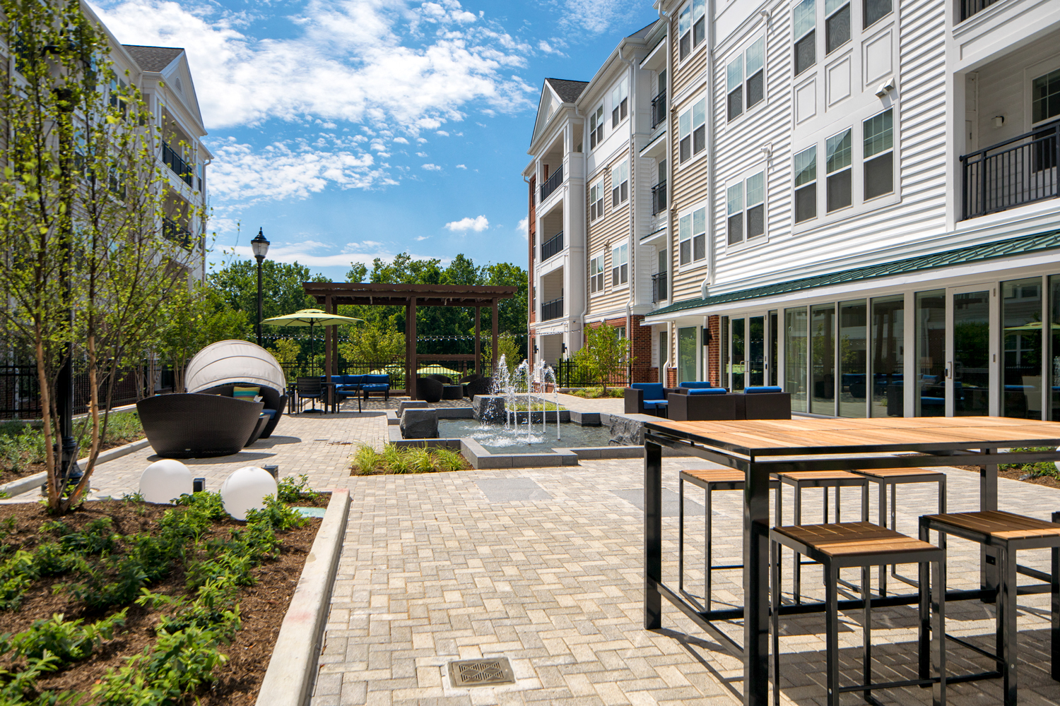 Courtyard for outdoor living, offering gorgeous water feature, cabana, pergola lounge area and grilling station