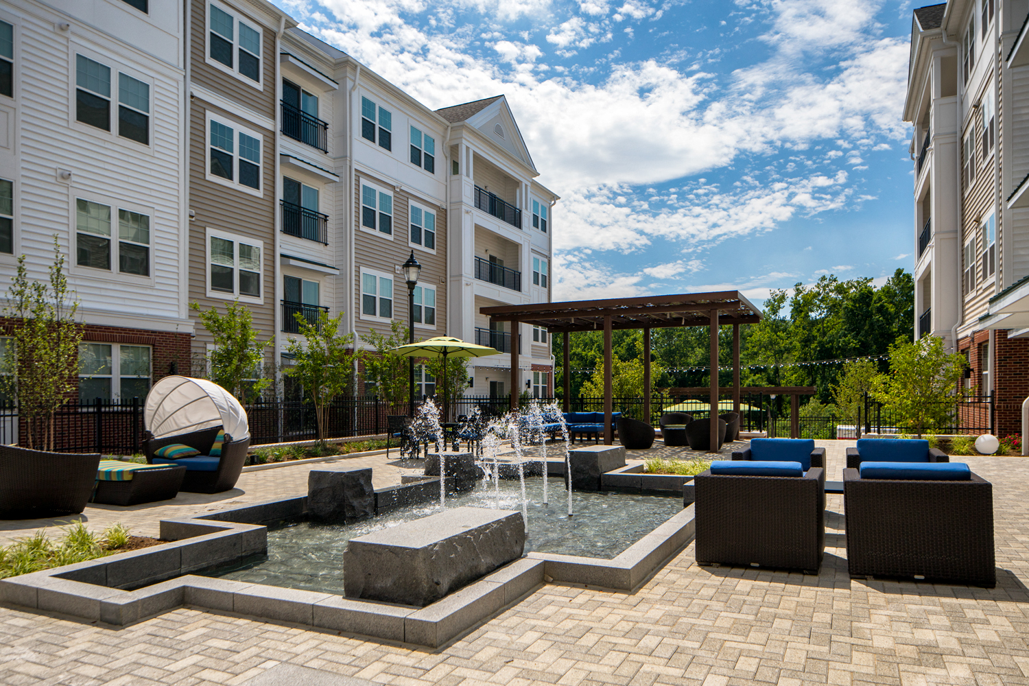 Courtyard for outdoor living, offering gorgeous water feature, cabana, pergola lounge area and grilling station