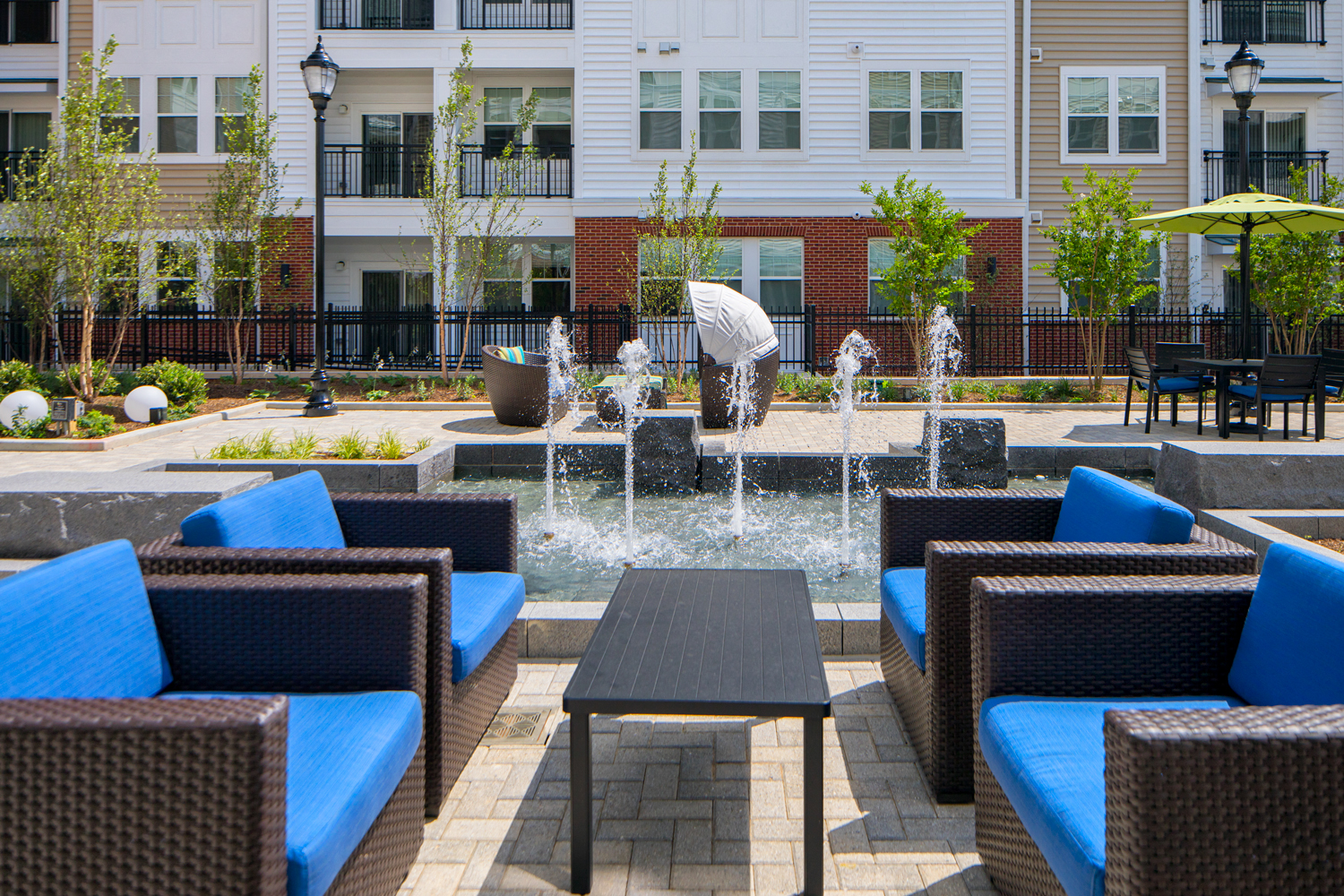 Courtyard for outdoor living, offering gorgeous water feature, cabana, pergola lounge area and grilling station