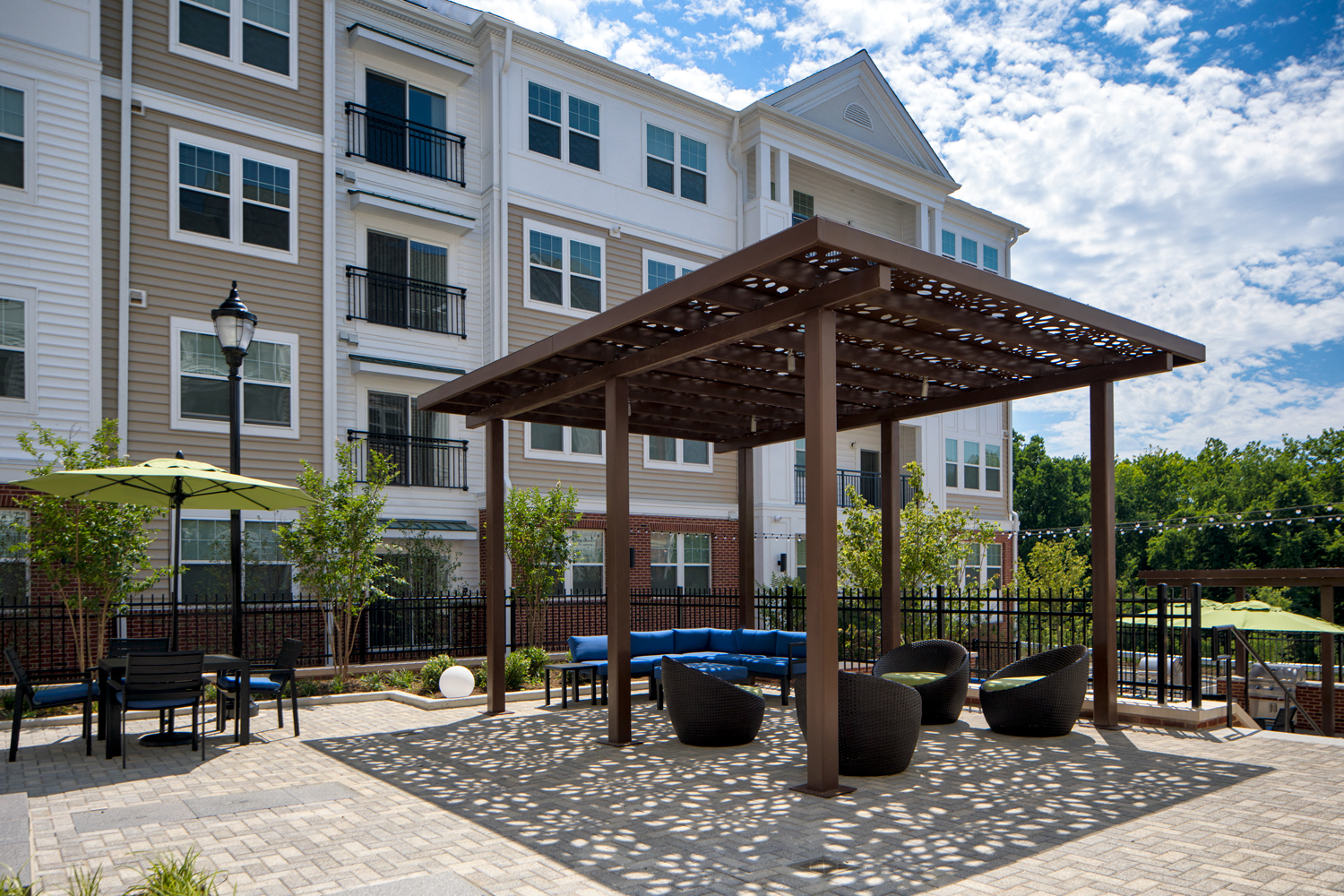 Courtyard for outdoor living, offering gorgeous water feature, cabana, pergola lounge area and grilling station