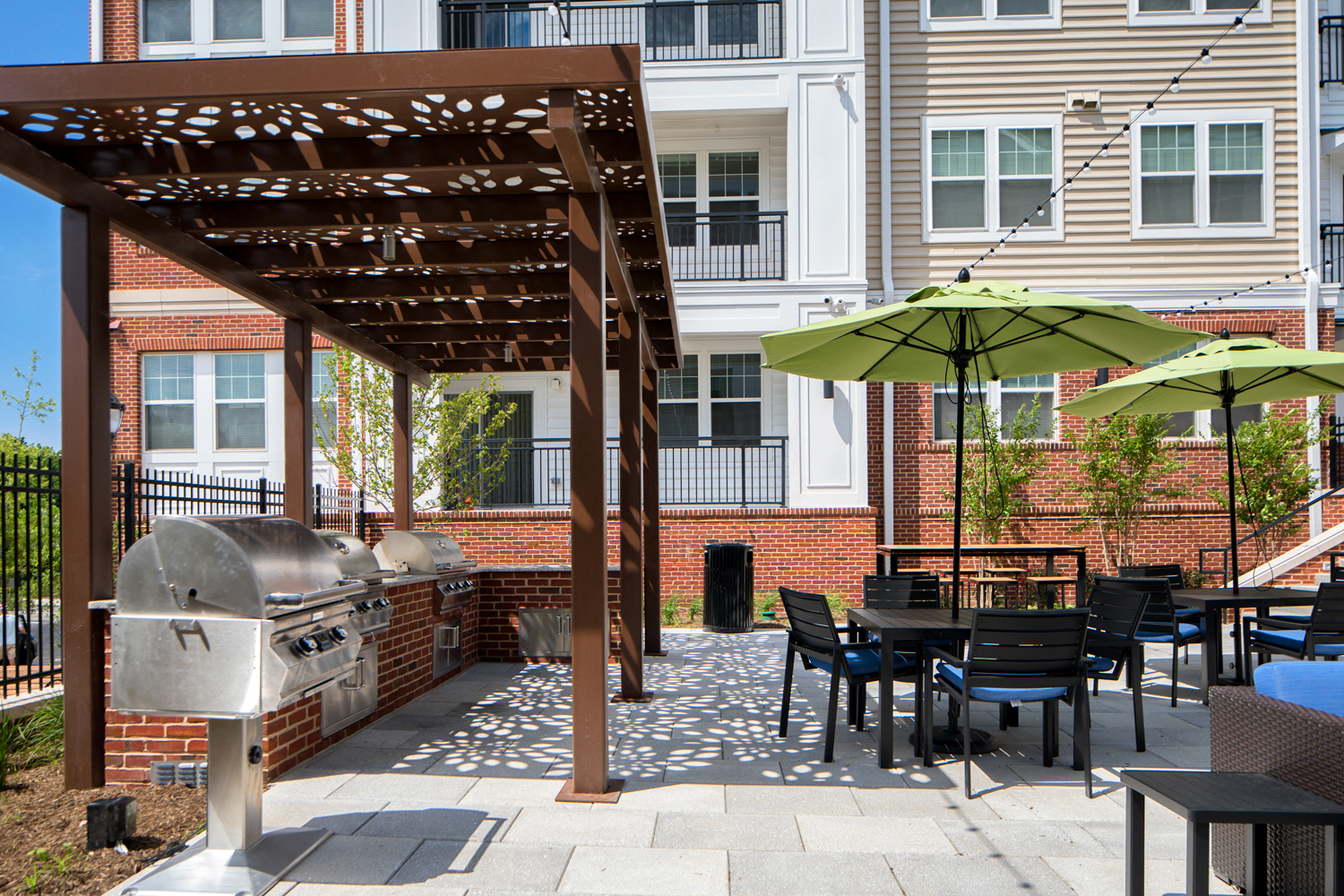 Courtyard for outdoor living, offering gorgeous water feature, cabana, pergola lounge area and grilling station