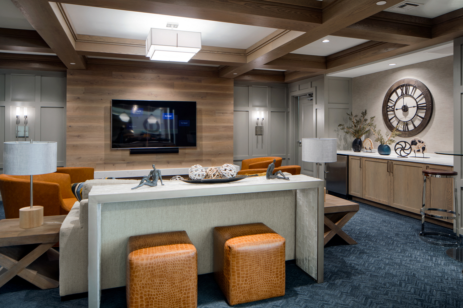 Coffeehouse-style lounge, featuring high-top tables, plush seating areas, wood-beamed ceiling and a grand, gas fireplace with marble surround