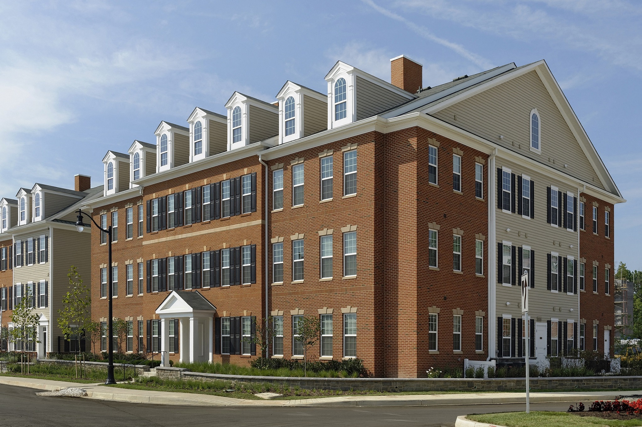 a large brick building with a street in front of it