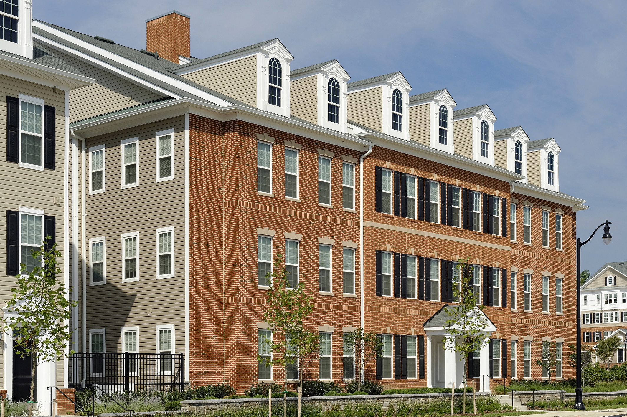 a large brick building with a street in front of it
