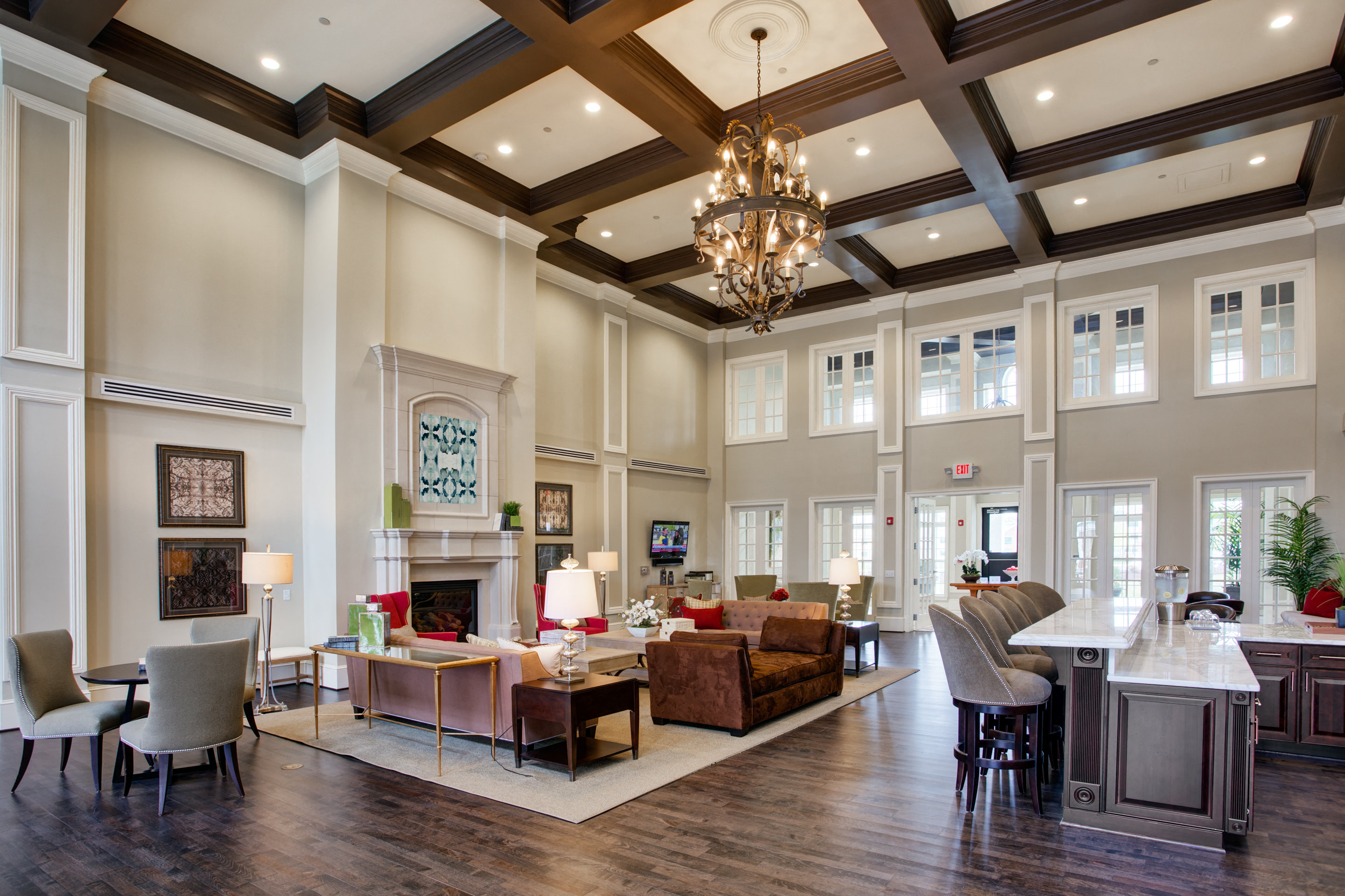 a large living room with furniture and a fireplace