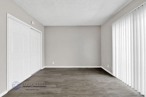 the upstairs bedroom has a large closet and a large window