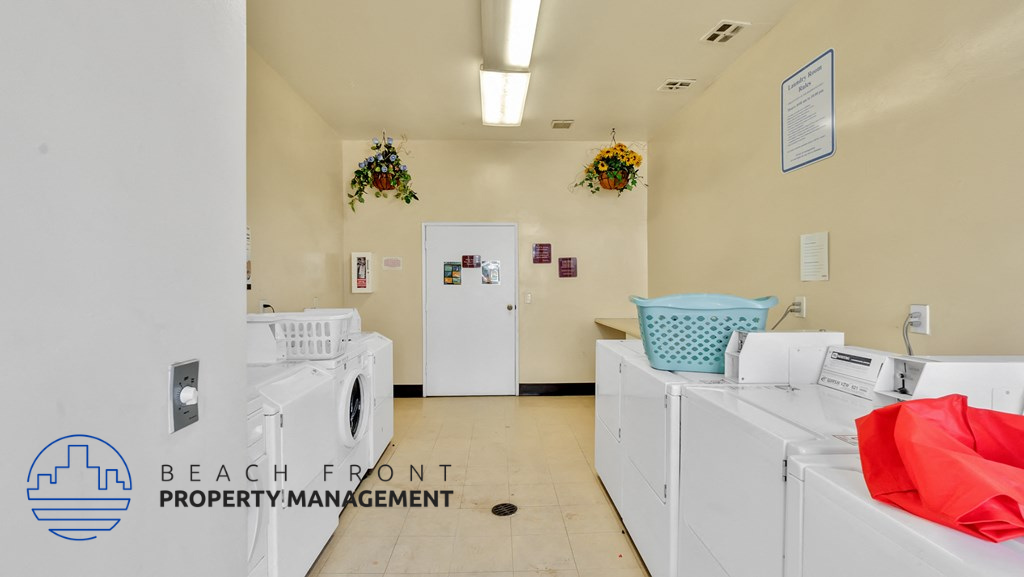 a laundry room filled with washers and dryers in a laundromat