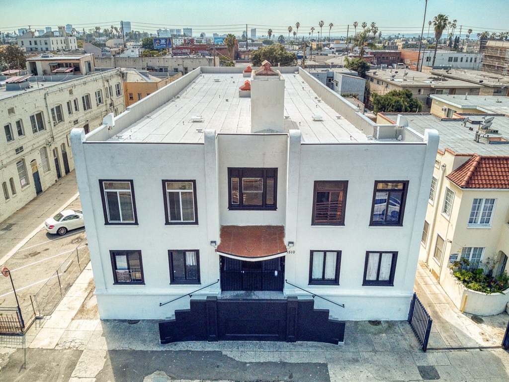 the back of the house has been painted white and the roof has been repaired