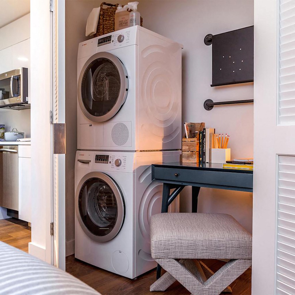 a small laundry room with a washing machine and dryer